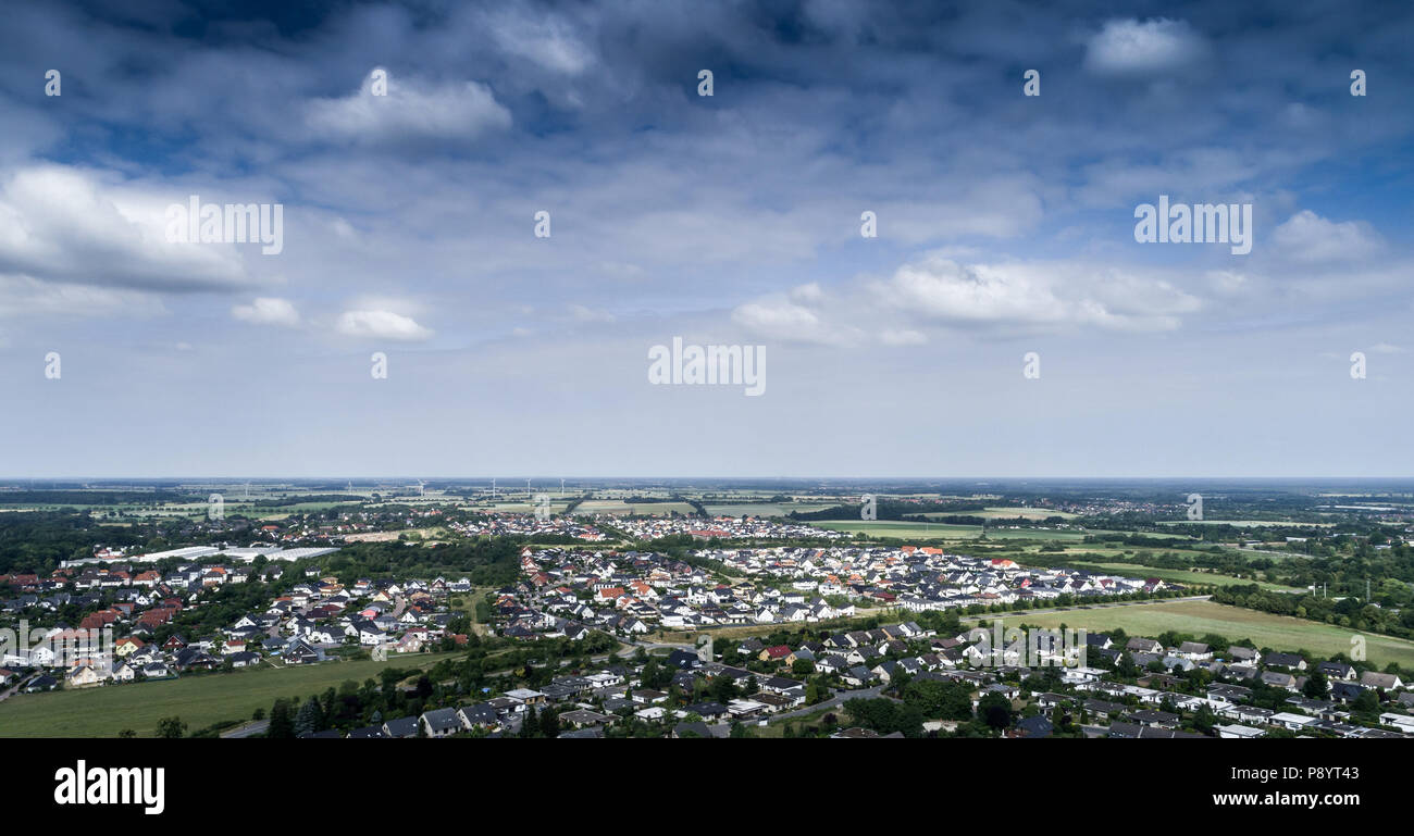 Aerial view of a suburb with detached houses, semi-detached houses and terraced houses with small front gardens and green lawns in northern Germany, t Stock Photo