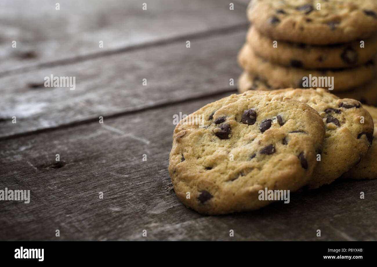 Rounded chocolate cookies on natural old desk. Stock Photo