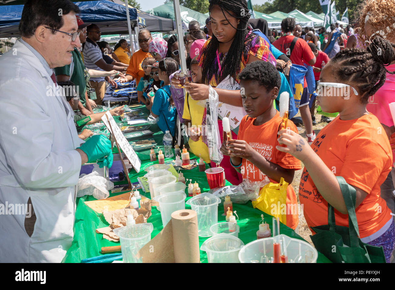 Detroit, Michigan - Dr. Emil Lozanov of Wayne State University helps students experiment with dry ice at Metro Detroit Youth Day. Thousands of childre Stock Photo