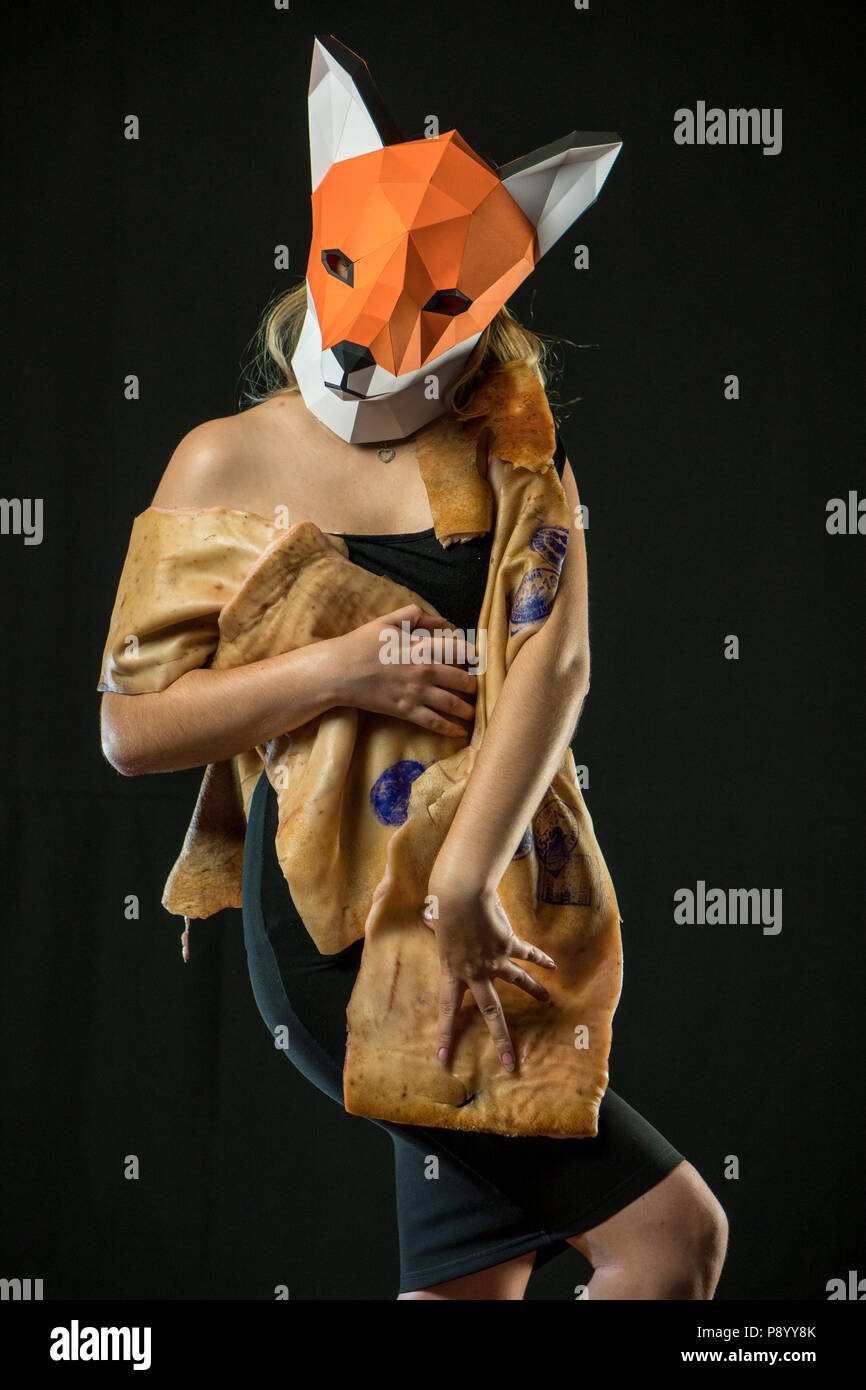 Blonde Girl with Fox Mask paper Using Pig Skin for Covering. Dead Animal  Concept Stock Photo - Alamy