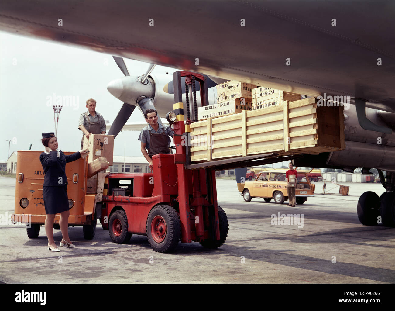 Berlin, GDR, airplane of the Interflug is loaded Stock Photo