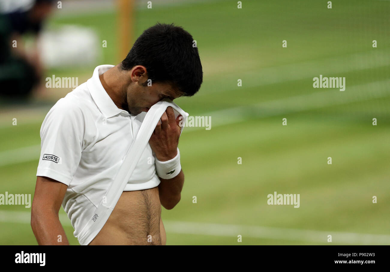 Contaminated Political do homework Novak Djokovic wipes his face with his t shirt on day eleven of the  Wimbledon Championships at the All England Lawn Tennis and Croquet Club,  Wimbledon Stock Photo - Alamy