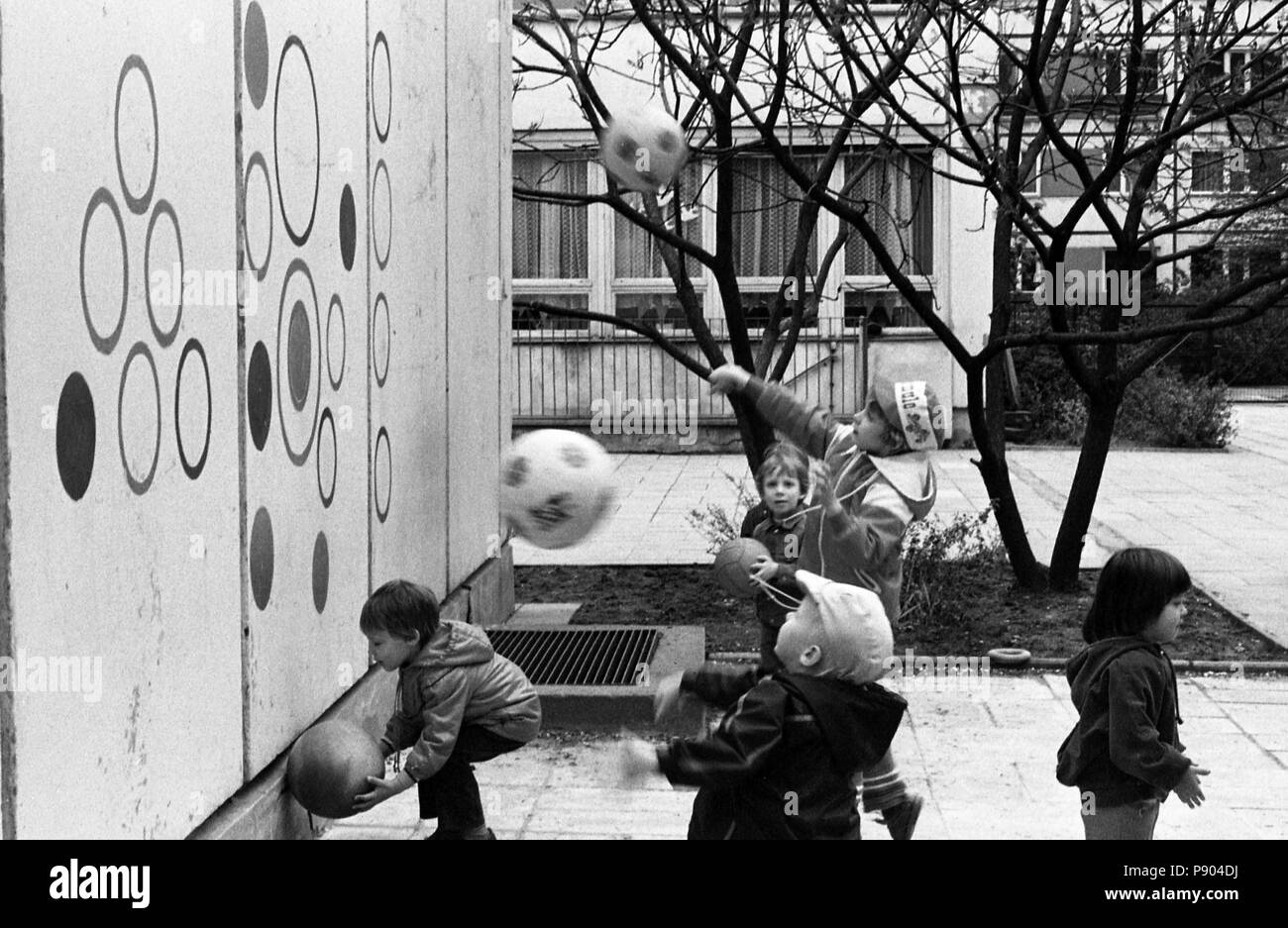 Berlin, GDR, boys throwing Baelle in a daycare against a goal wall Stock Photo