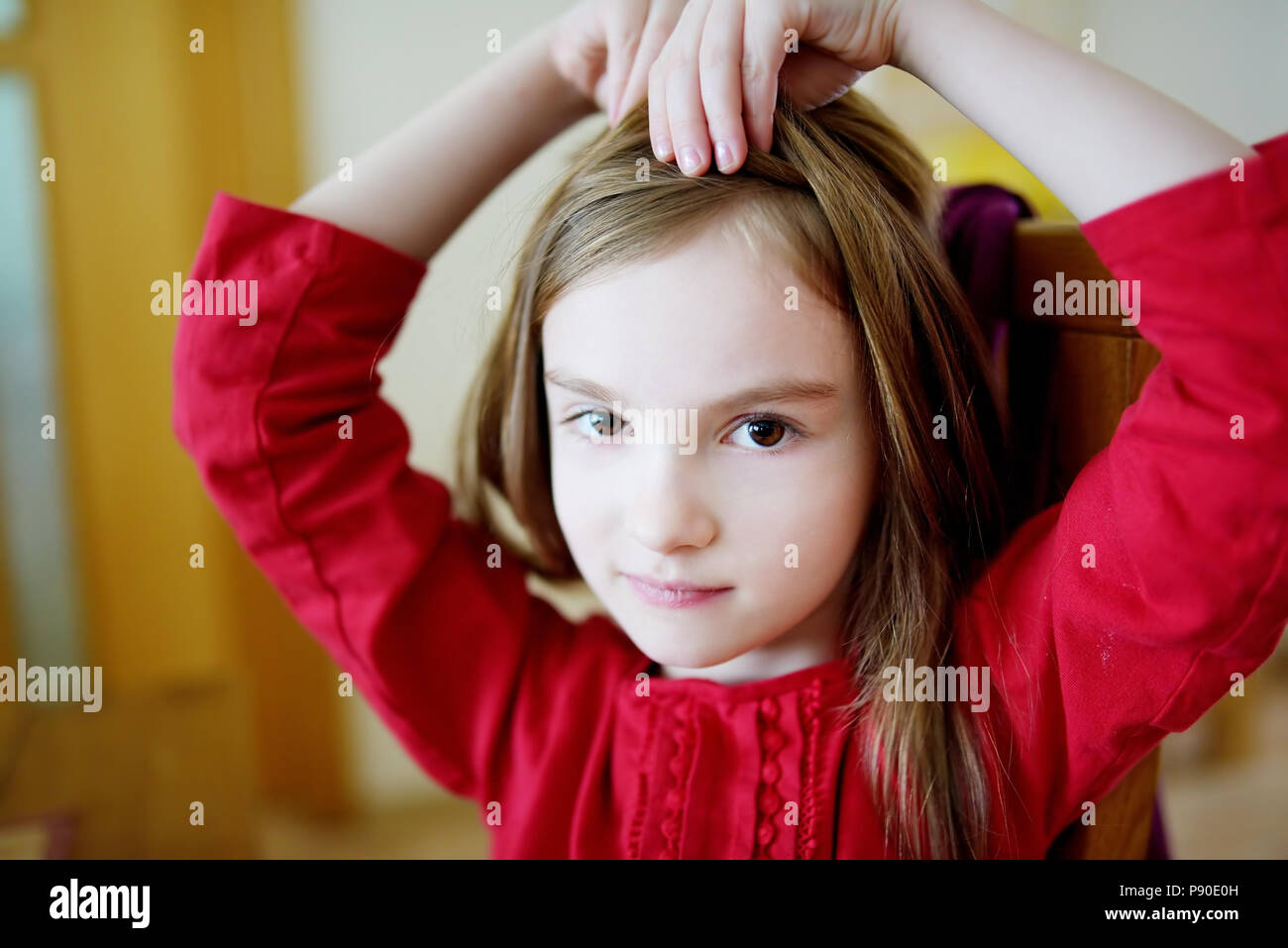 Portrait of a cute little happy girl at home Stock Photo - Alamy