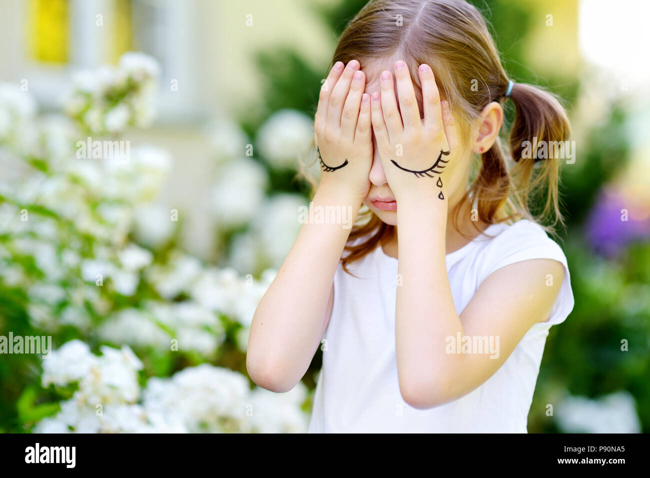 Premium Photo  Child girl sad profile face close up with hands on cheek.