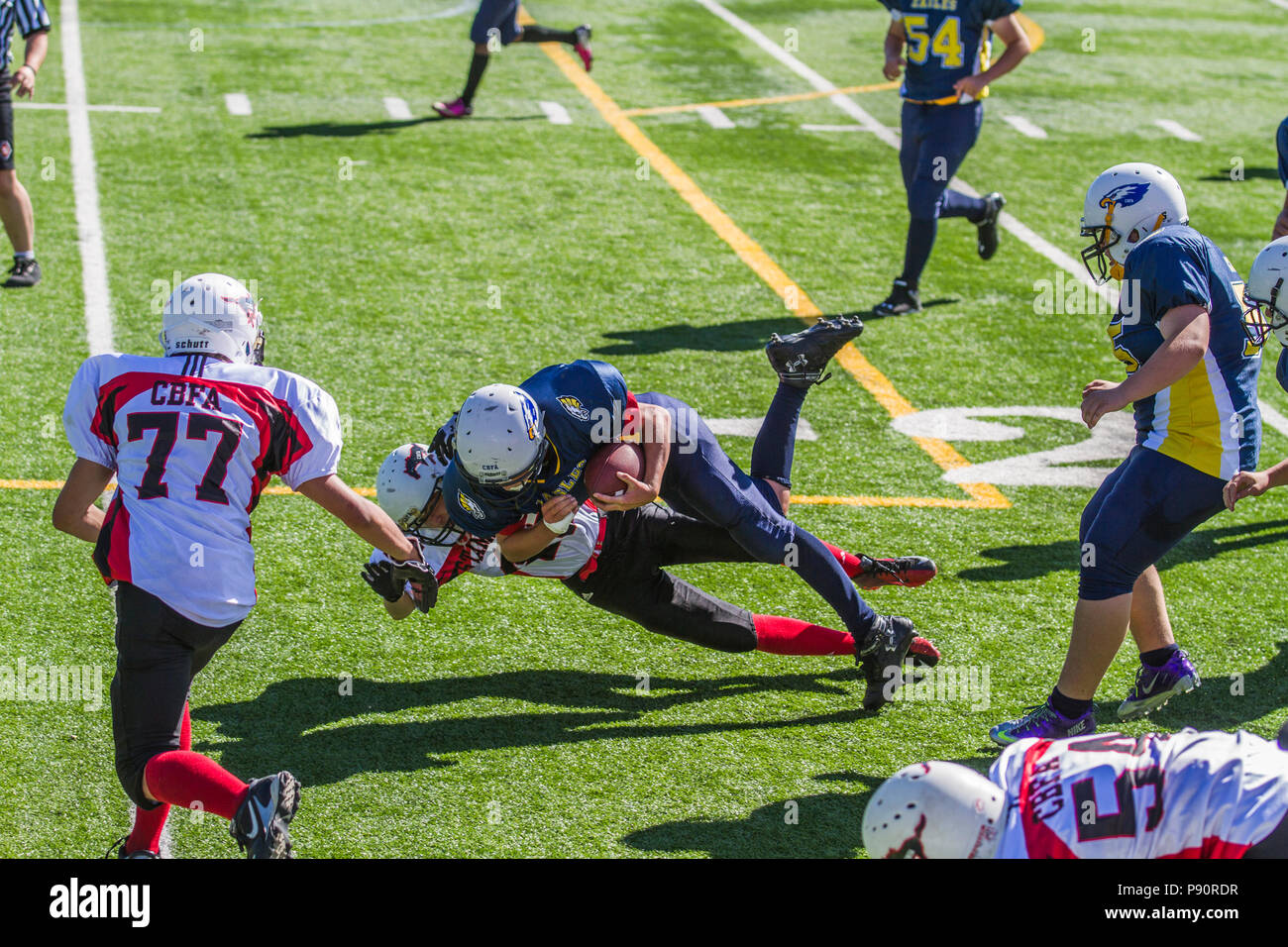 Dramatic, colorful action photo's of Boys Bantam football in Calgary