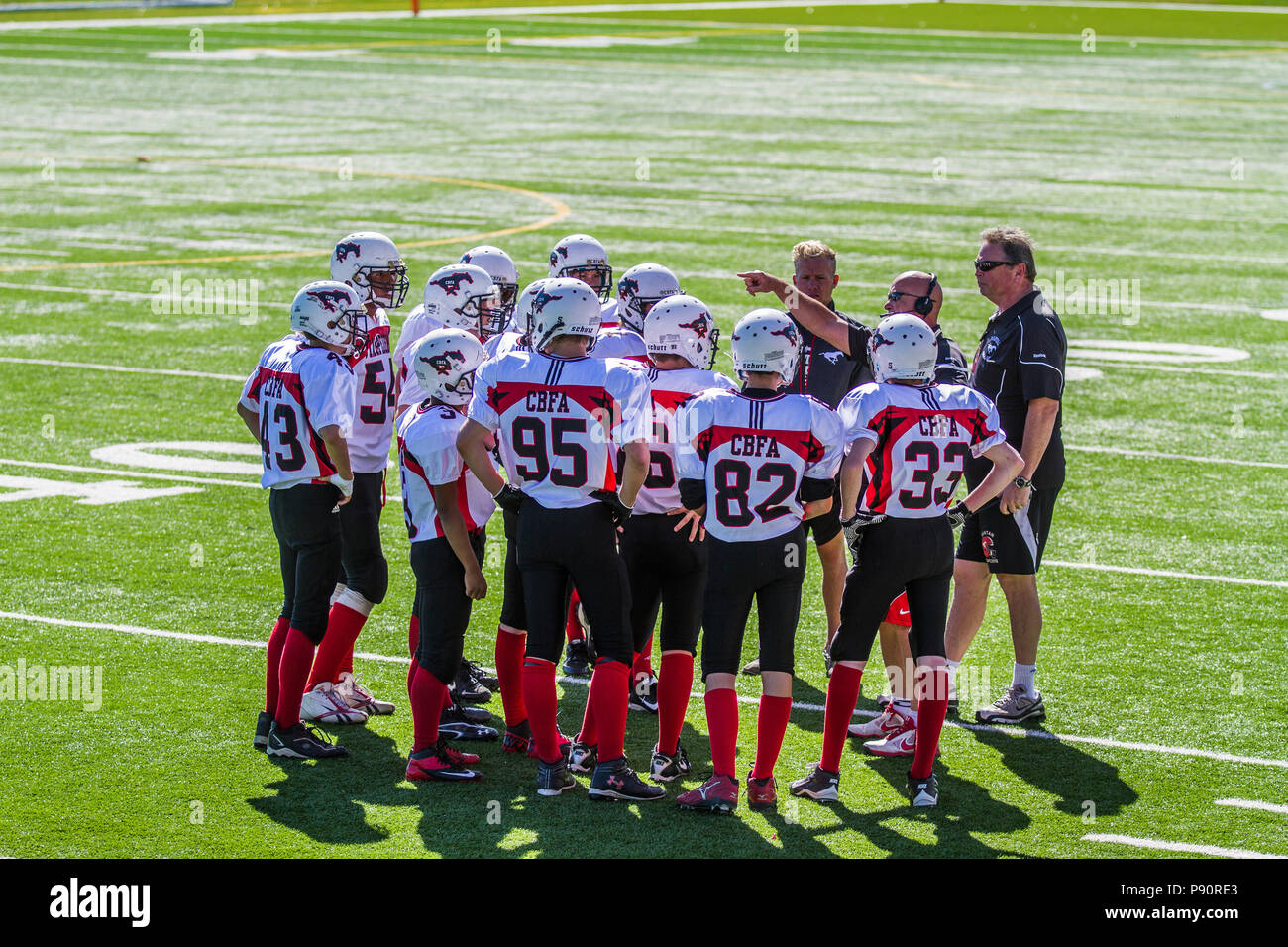Dramatic, colorful action photo's of Boys Bantam football in Calgary