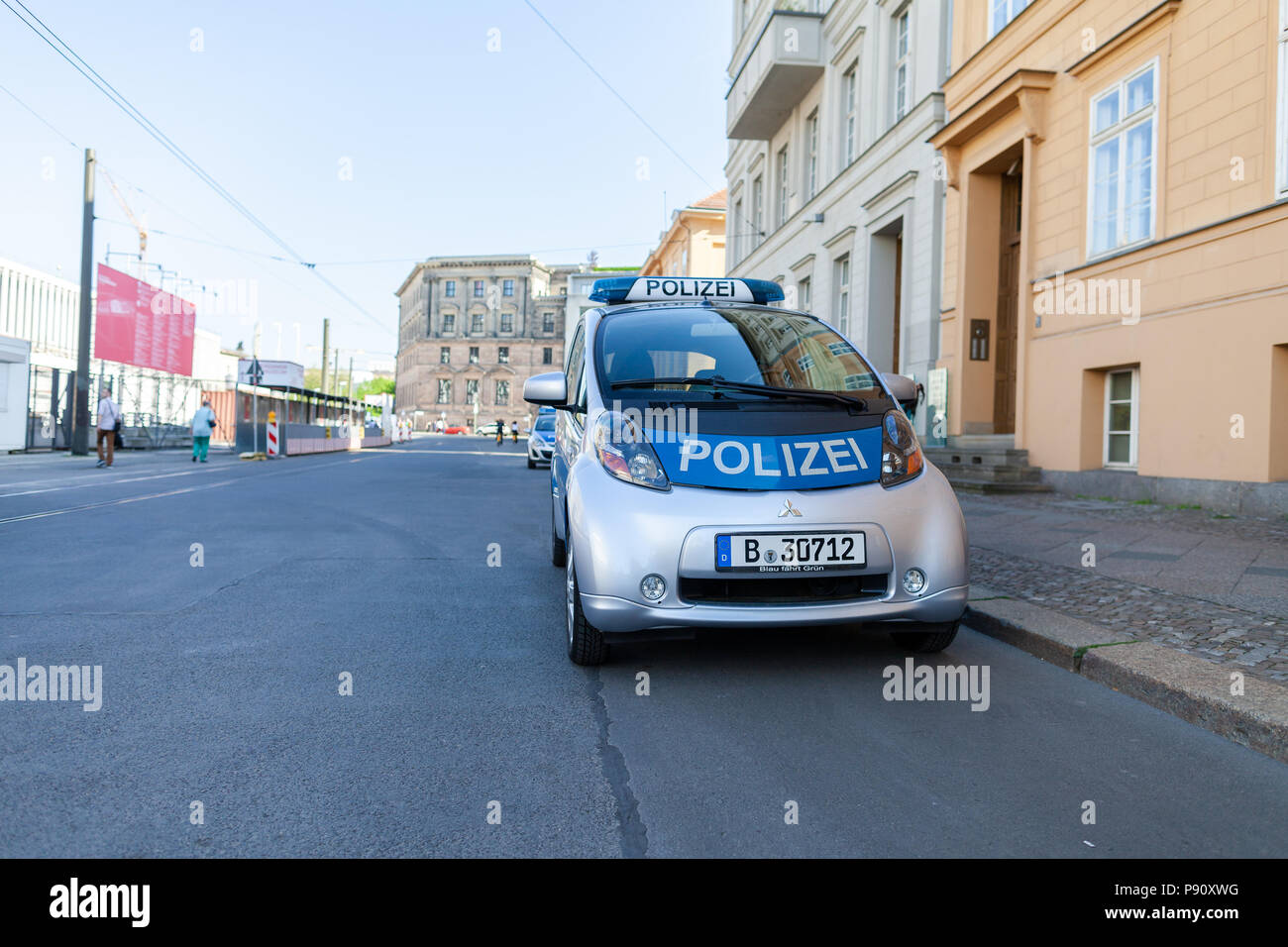 BERLIN / GERMANY - APRIL 29, 2018: Electric german police car, Mitsubishi MiEV stands on a street in Berlin. Polizei is the german word for police. Stock Photo