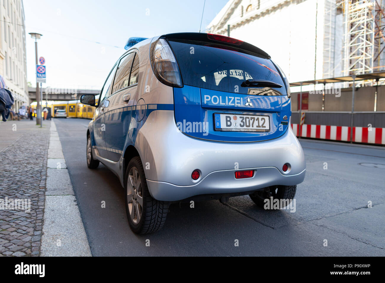 BERLIN / GERMANY - APRIL 29, 2018: Electric german police car, Mitsubishi MiEV stands on a street in Berlin. Polizei is the german word for police. Stock Photo