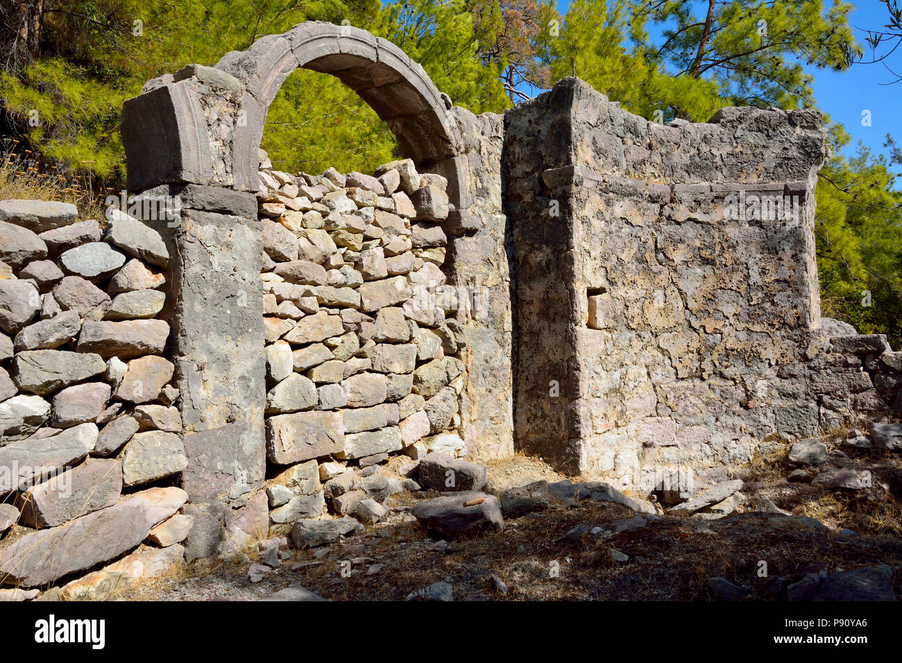 Ruins of Byzantine church Gerbekilise in pine forest on Bozburun peninsula near Marmaris resort town in Turkey. Stock Photo