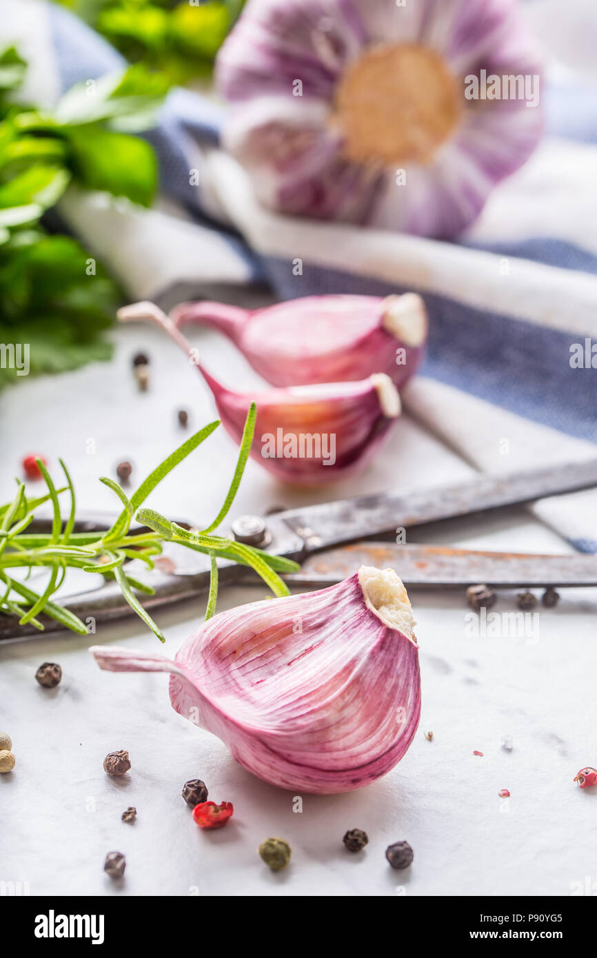 Closeup Garlic Cloves and Bulbs with rosemary salt and pepper Stock