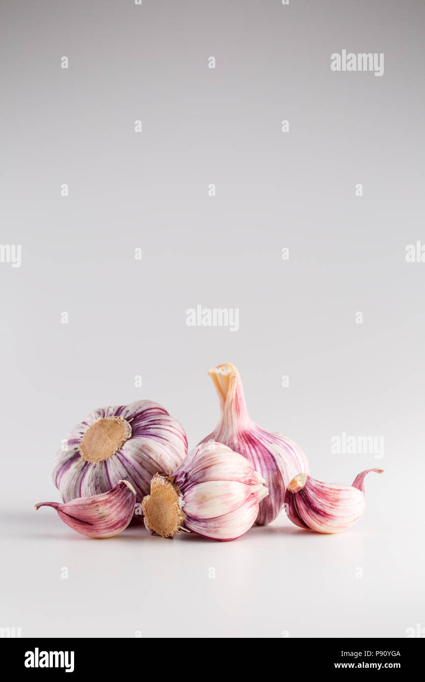 Garlic Cloves and Bulbs over white background Stock Photo - Alamy