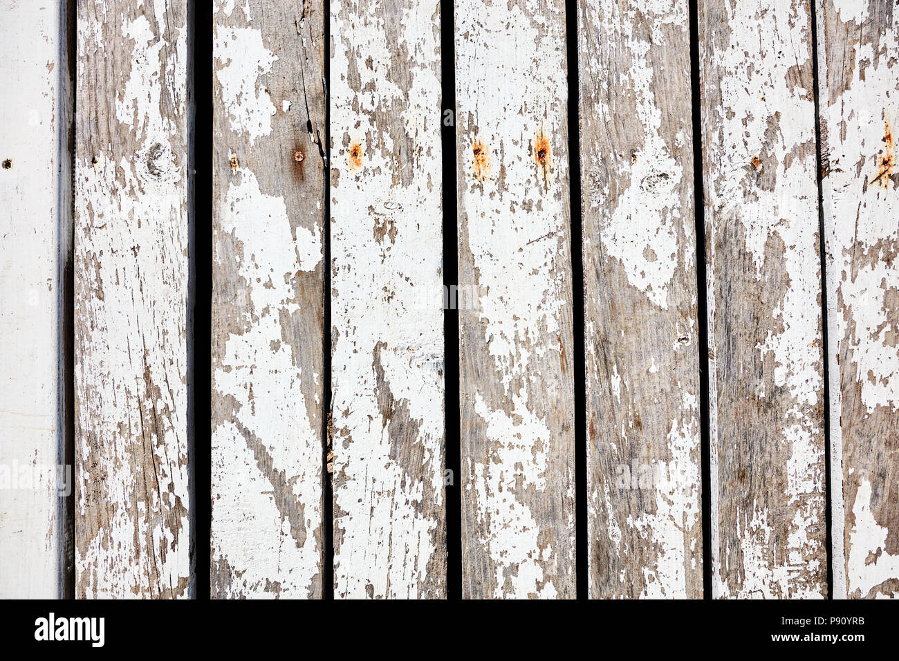 Overhead of rustic wooden planks with worn white paint for background backdrop use Stock Photo