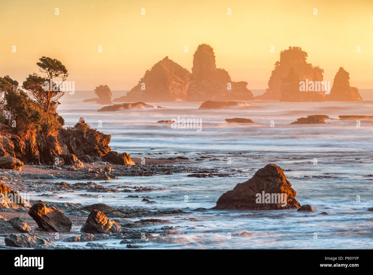 Sunset at one of New Zealand's most dramtic bits of scenery, Motukiekie, on the West Coast of the South Island. Stock Photo