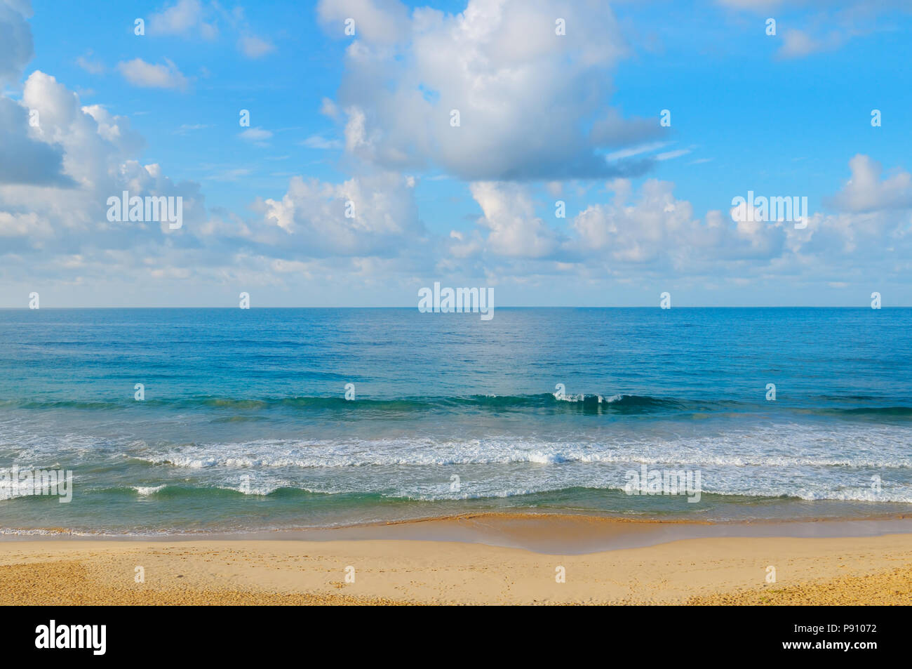 ocean, sandy beach and blue sky Stock Photo - Alamy