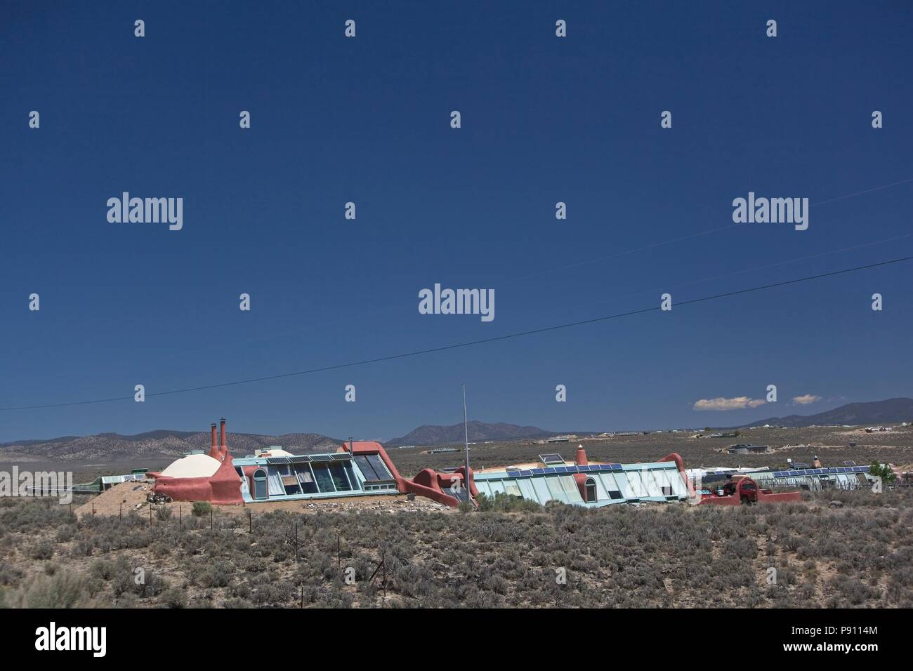 Innovative and sustaining earthship housing found on the outskirts of Taos New Mexico. The houses use recycled and sustainable materials and rely on p Stock Photo