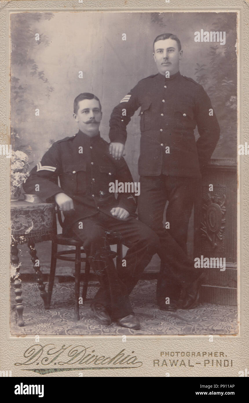 Victorian Rawalpindi, Pakistan Cabinet Card of Two Soldiers. A Sergeant and Corporal of The British Army. The Corporal Has a Marksman Badge Stock Photo