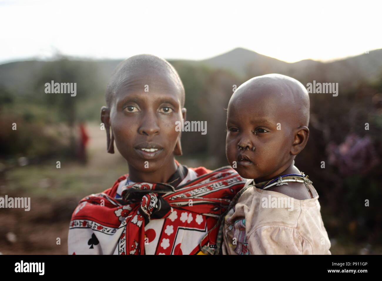 Young Maasai tribal women mother with her Maasai baby child portrait Stock Photo