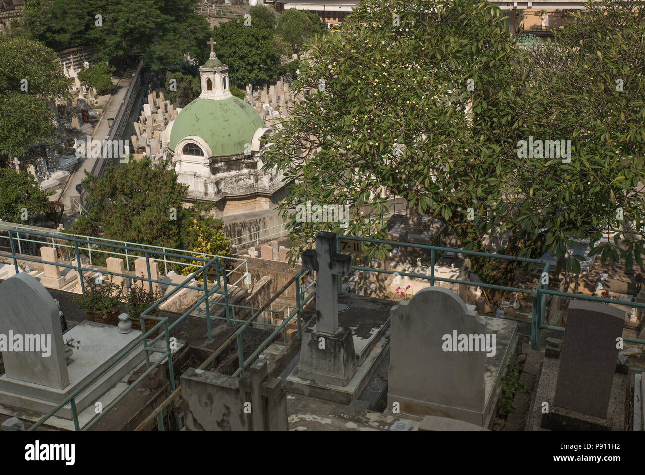 Cemetery in Hong Kong downtown on sunny day Stock Photo