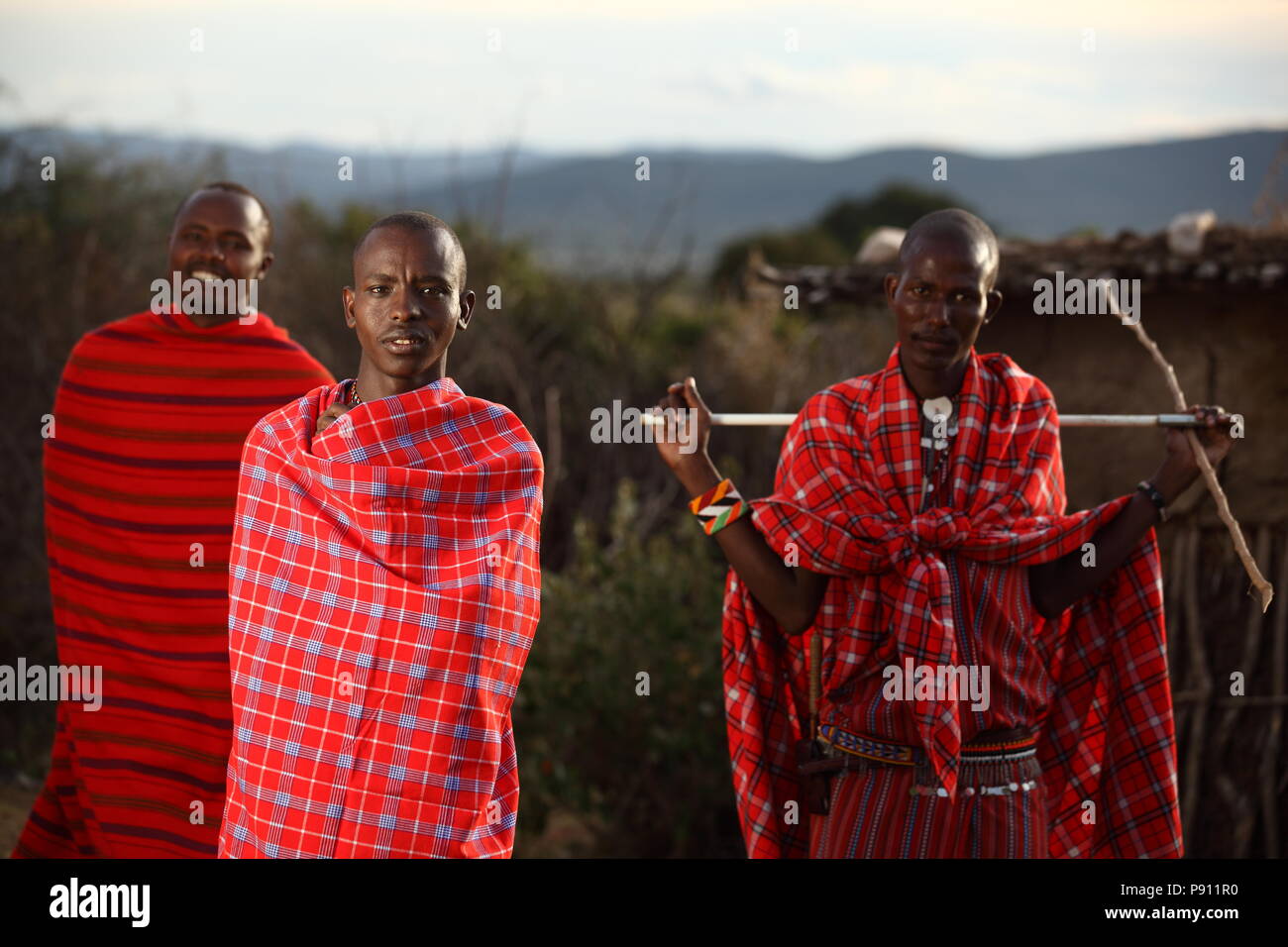 Maasai traditional men in traditional Maasai red dress smiling portrait Stock Photo