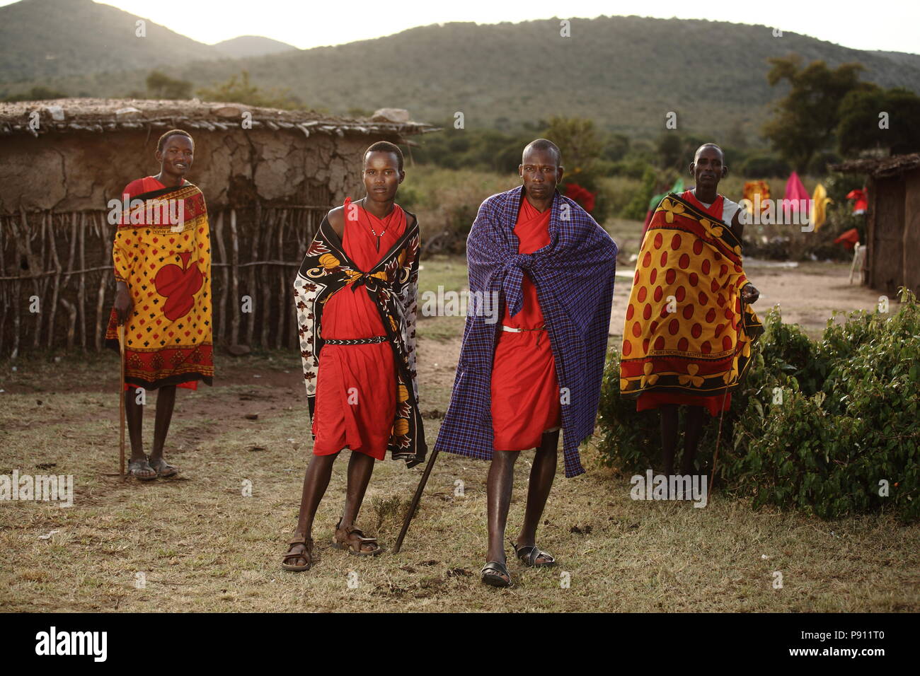 Maasai traditional men in traditional Maasai red dress smiling portrait Stock Photo