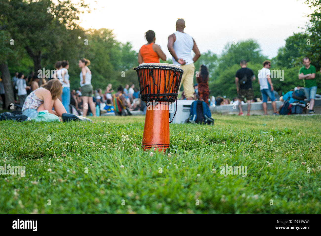 Montreal, Quebec, Canada - 2 July 2017: Two girls observing the famous drum circle Tam Tams in Parc du Mont Royal at the base of Mont Royal in Montrea Stock Photo