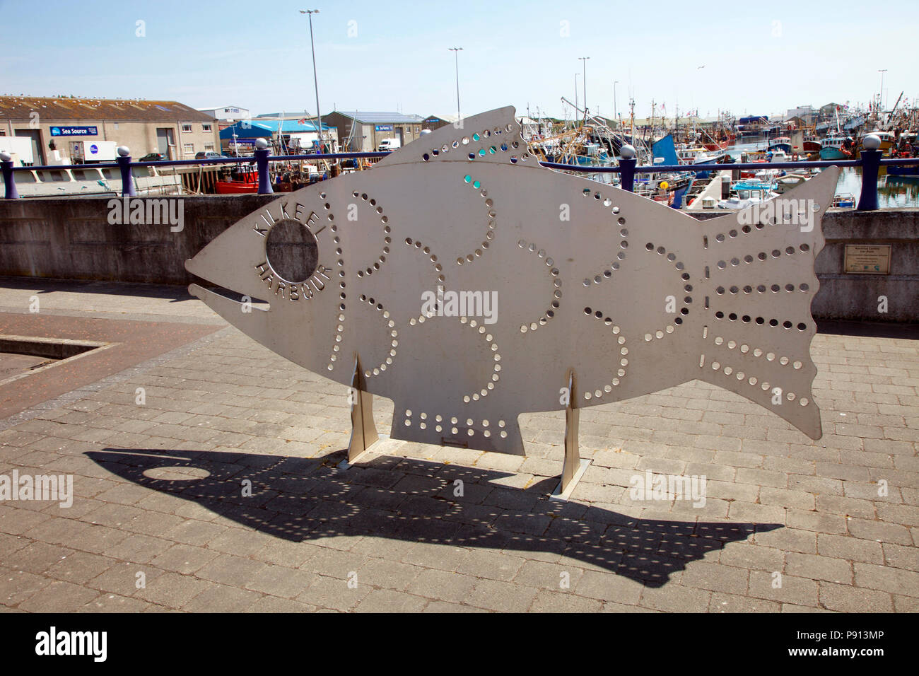 Steel sculpture of a fish, Kilkeel Harbour, home to Northern Ireland’s largest fishing fleet Stock Photo