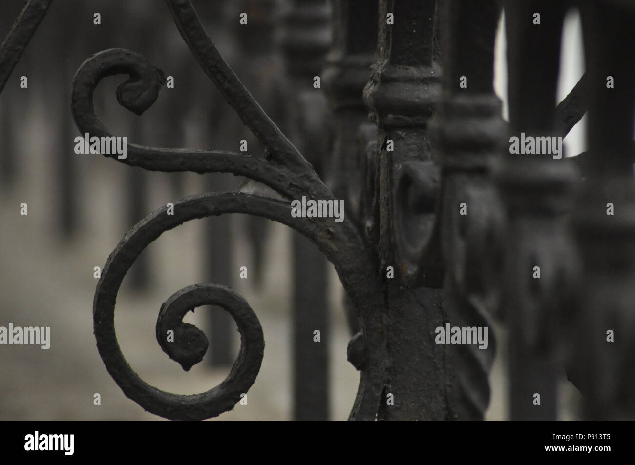 cast iron fence painted black Stock Photo