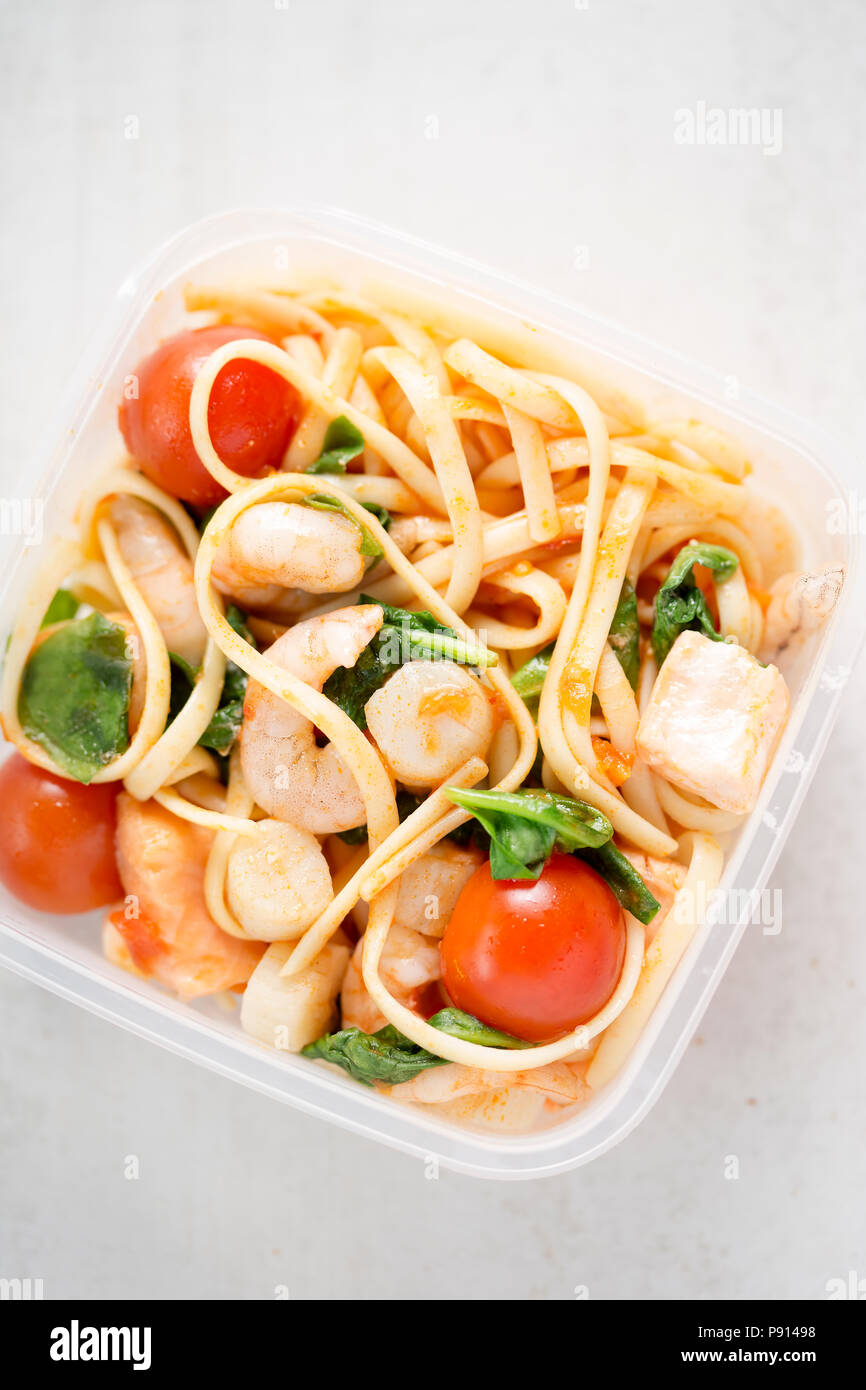 Seafood linguine with prawns, scallops and salmon, spinach and tomatoes