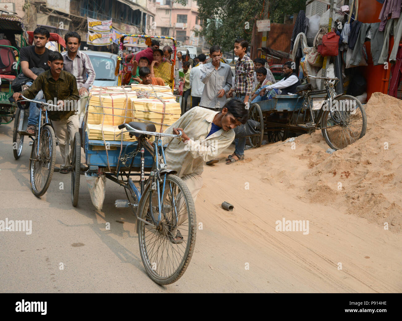 Tricycles, tuc tucs in the the busy streets of Old Delhi India Stock