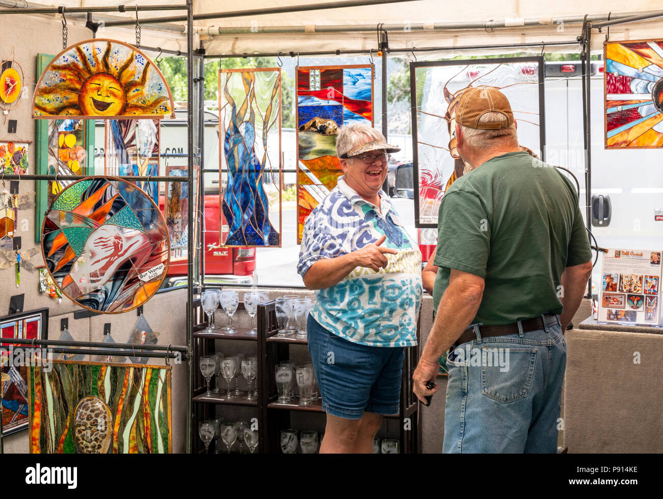 Patrons visit artist booths during annual small town art fair; Salida; Colorado; USA Stock Photo