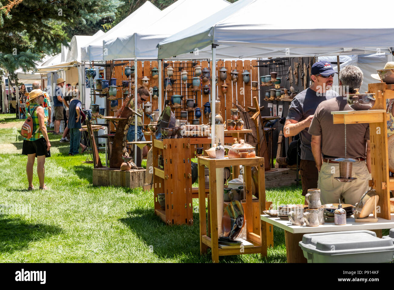 Patrons visit artist booths during annual small town art fair; Salida; Colorado; USA Stock Photo