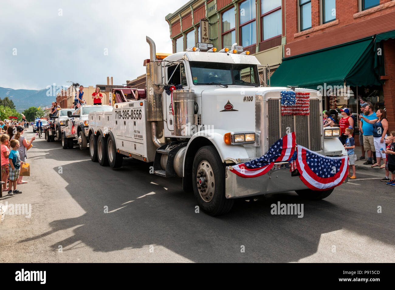 Alpine tow trucks in annual Fourth of July Parade in the small mountain town of Salida; Colorado; USA Stock Photo