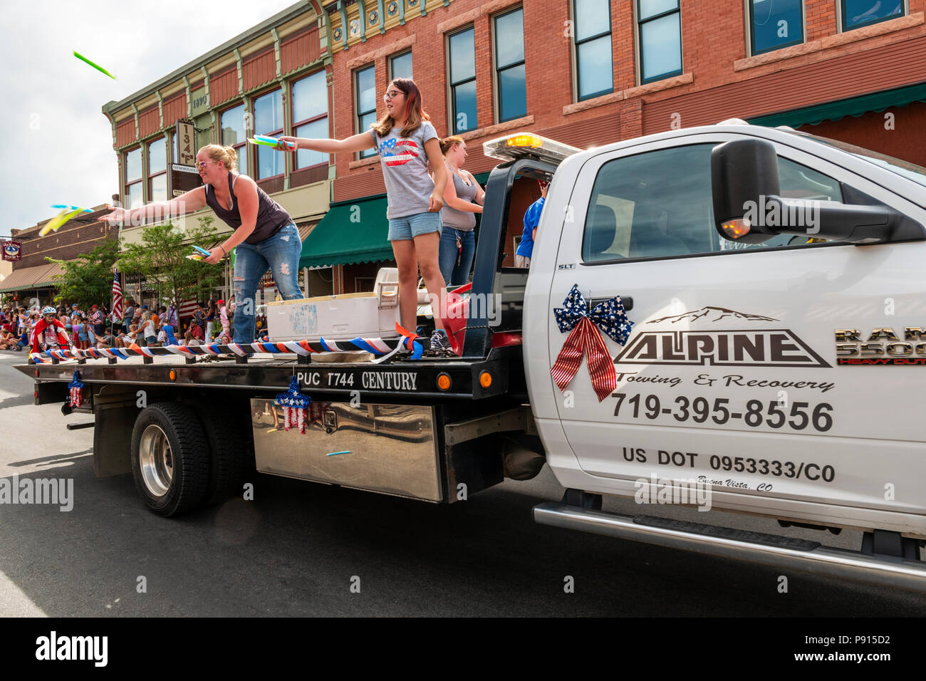 Alpine tow trucks in annual Fourth of July Parade in the small mountain town of Salida; Colorado; USA Stock Photo
