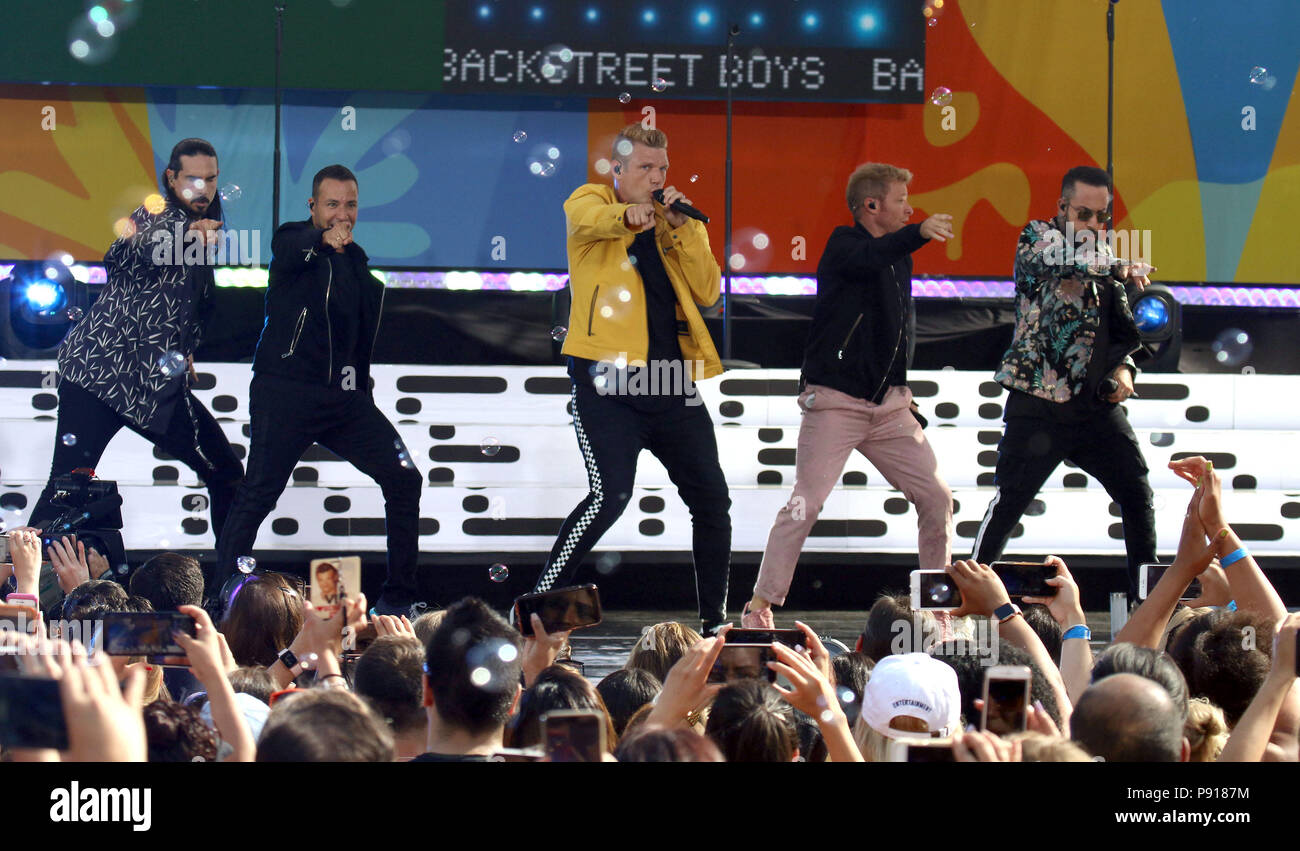 New York City, New York, USA. 13th July, 2018. BACKSTREET BOYS (L-R) KEVIN RICHARDSON, HOWIE D, NICK CARTER, BRIAN LITTRELL and AJ MCLEAN perform with bubbles on 'Good Morning America' held in Central Park. Credit: Nancy Kaszerman/ZUMA Wire/Alamy Live News Stock Photo