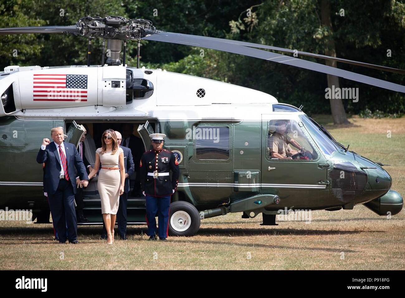 London, UK, 13 July 2018. U.S President Donald Trump, left, and First Lady Melania Trump arrive by Marine One at Winfield House, the American Ambassador resident July 12, 2018 in London, England. Credit: Planetpix/Alamy Live News Stock Photo