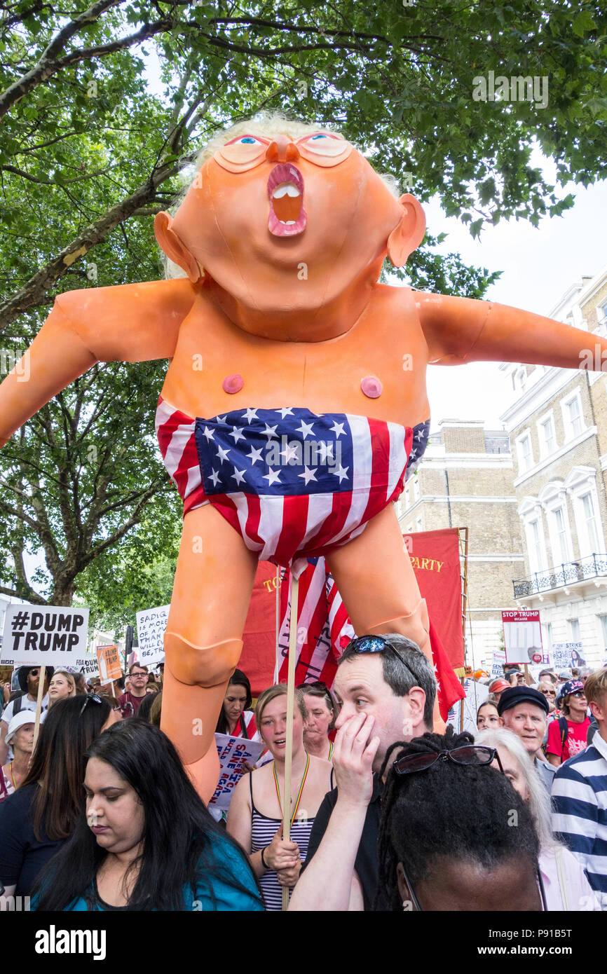A huge plastic inflatable blow-up doll of Donald Trump as protestors marched against Donald Trump's visit to the UK © Benjamin John/ Alamy Live News. Stock Photo