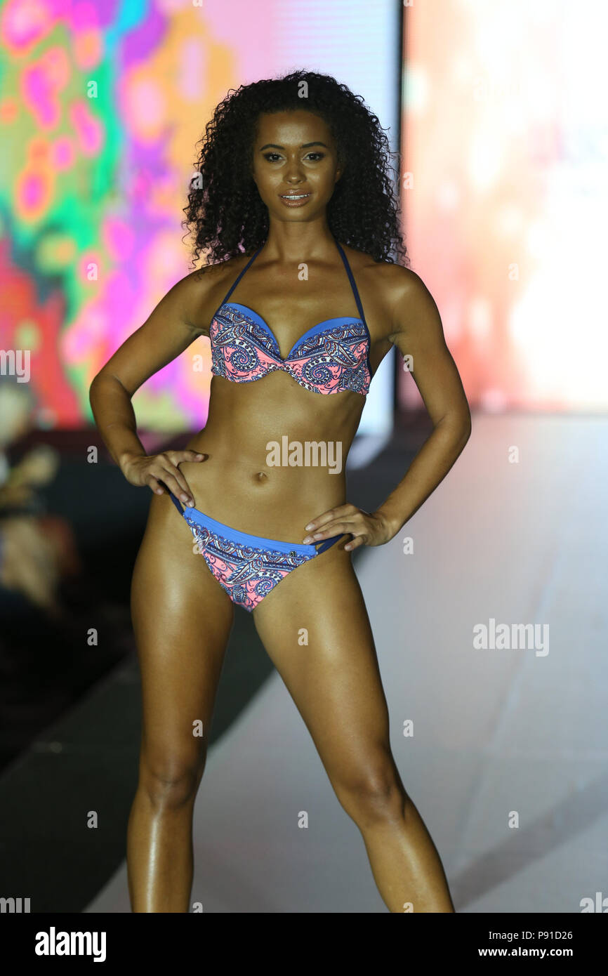 MIAMI BEACH, FL - JULY 13: A model walks the runway for Lascana Swimwear  durning the Miami Swim Week presented by Planet Fashion sponsored by Jungle  Island at The Lowes Hotel on