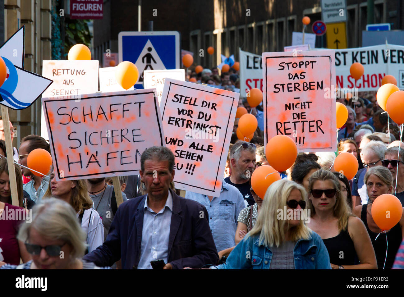Cologne, Germany, 13 July 2018. Several thousand people demonstrate on July 13, 2018 in Cologne for the rescue of refugees from the Mediterranean Sea. Under the motto 'Stop dying in the Mediterranean', a coalition of initiatives, political groups and private individuals wants to send a signal for humanity. Cologne, Germany.   Credit: Joern Sackermann/Alamy Live News Stock Photo