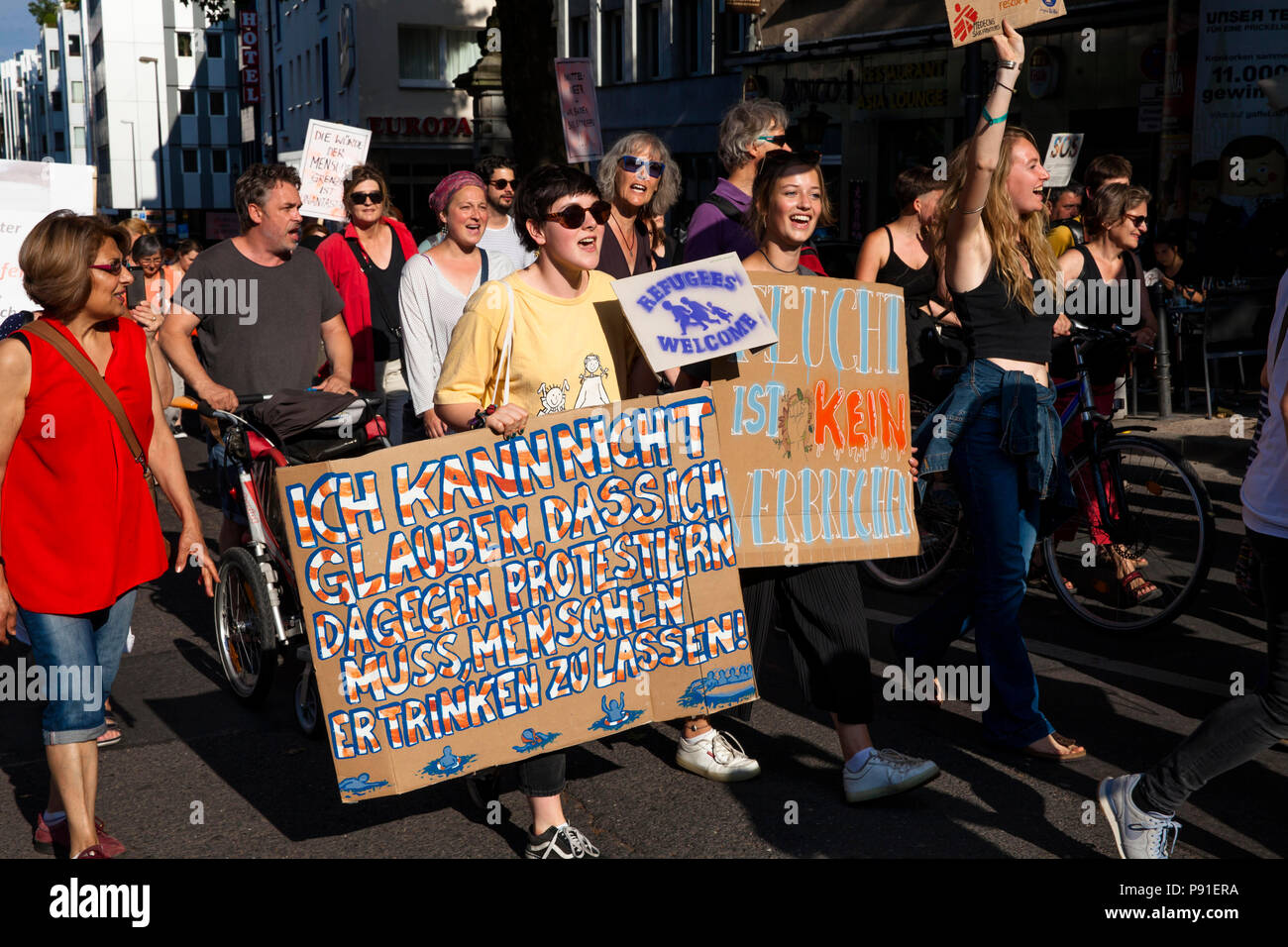 Cologne, Germany, 13 July 2018. Several thousand people demonstrate on July 13, 2018 in Cologne for the rescue of refugees from the Mediterranean Sea. Under the motto 'Stop dying in the Mediterranean', a coalition of initiatives, political groups and private individuals wants to send a signal for humanity. Cologne, Germany.   Credit: Joern Sackermann/Alamy Live News Stock Photo