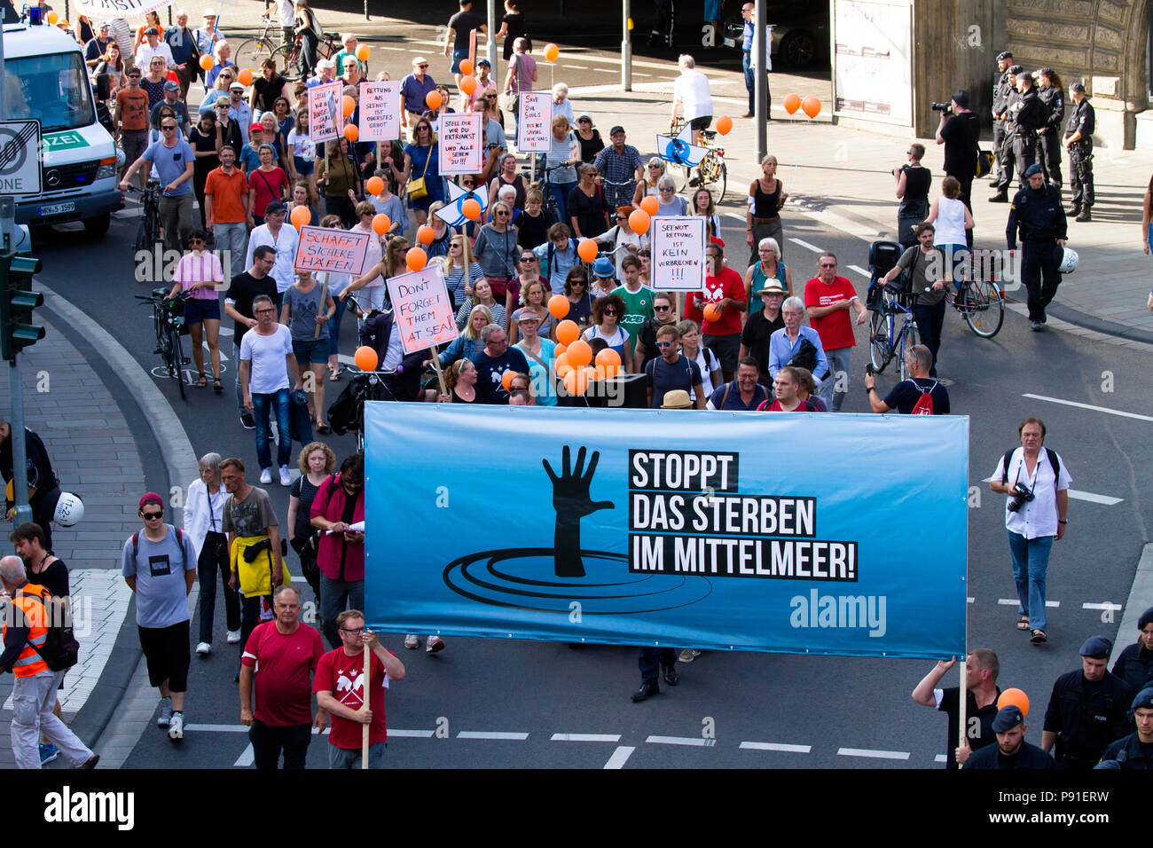 Cologne, Germany, 13 July 2018. Several thousand people demonstrate on July 13, 2018 in Cologne for the rescue of refugees from the Mediterranean Sea. Under the motto 'Stop dying in the Mediterranean', a coalition of initiatives, political groups and private individuals wants to send a signal for humanity. Cologne, Germany.   Credit: Joern Sackermann/Alamy Live News Stock Photo