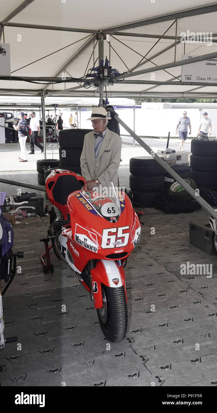 West Sussex, UK, 13th July, 2018.  Goodwood  Scenes at the Goodwood Festival of Speed, Goodwood House, home of the Duke of Richmond and Gordon.  Britain's showcase of everything automobile and fast. here Old World gentleman meets new world motor bike. Stock Photo