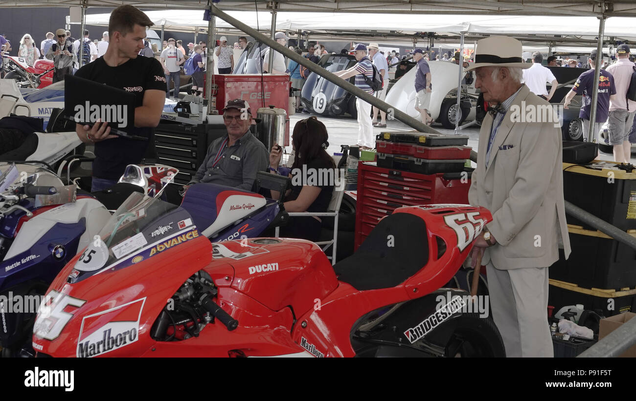 West Sussex, UK, 13th July, 2018.  Goodwood  Scenes at the Goodwood Festival of Speed, Goodwood House, home of the Duke of Richmond and Gordon.  Britain's showcase of everything automobile and fast. here Old World gentleman meets new world motor bike. Stock Photo