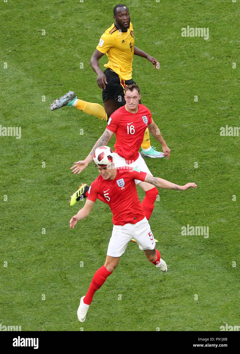 Saint Petersburg, Russia. 14th July, 2018. John Stones (bottom) of England competes for a header during the 2018 FIFA World Cup third place play-off match between England and Belgium in Saint Petersburg, Russia, July 14, 2018. Credit: Li Ming/Xinhua/Alamy Live News  Stock Photo