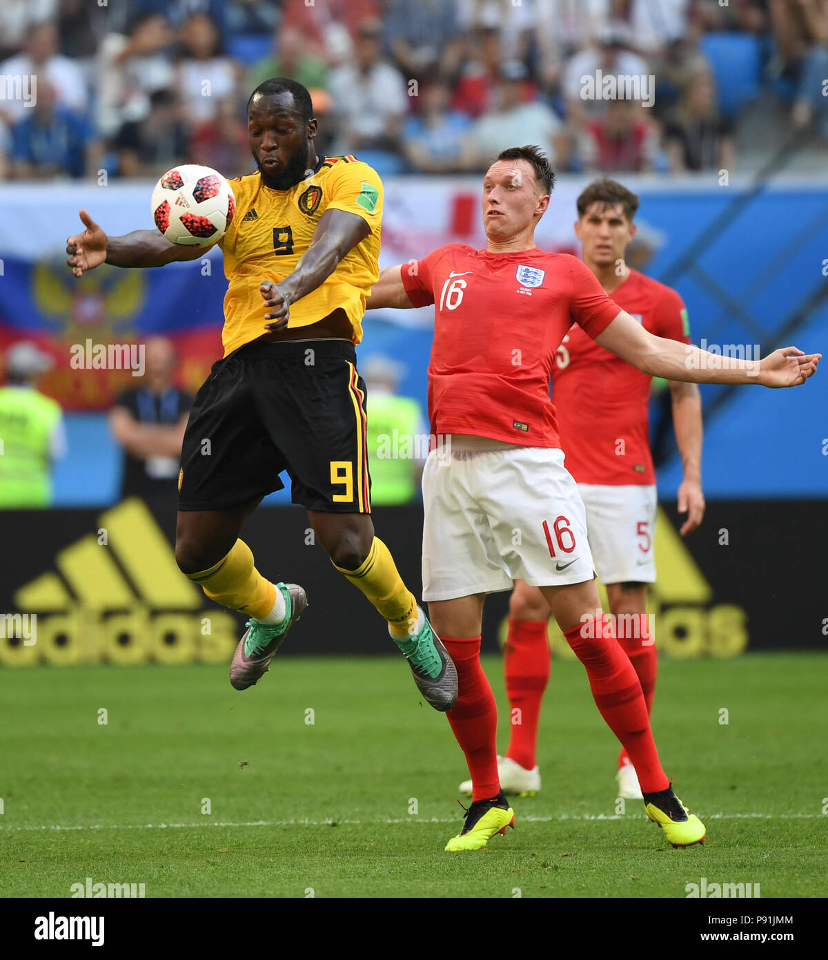 Saint Petersburg, Russia. 14th July, 2018. Phil Jones (R front) of England vies with Romelu Lukaku (L front) of Belgium during the 2018 FIFA World Cup third place play-off match between England and Belgium in Saint Petersburg, Russia, July 14, 2018. Credit: Li Ga/Xinhua/Alamy Live News Credit: Xinhua/Alamy Live News Stock Photo