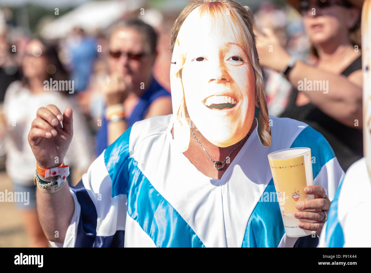 Brentwood Essex,  14th July 2018 Brentwood  Music Festival 2018 at Brentwood Centre   Abba fever fan with mask Credit Ian Davidson/Alamy Live News Stock Photo