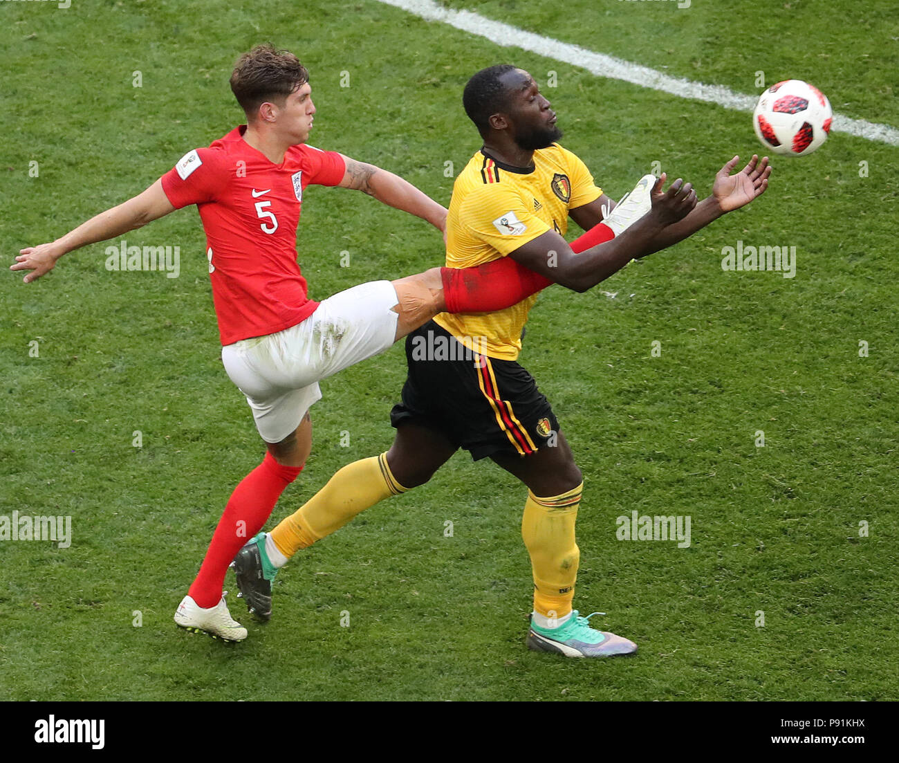 Saint Petersburg, Russia. 14th July, 2018. John Stones (L) of England vies with Romelu Lukaku of Belgium during the 2018 FIFA World Cup third place play-off match between England and Belgium in Saint Petersburg, Russia, July 14, 2018. Credit: Li Ming/Xinhua/Alamy Live News  Stock Photo