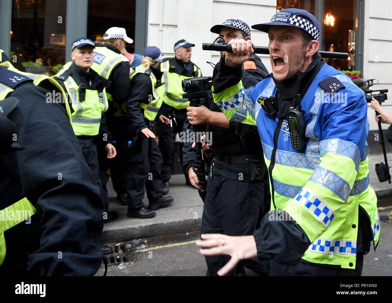 Anti-Fascist and pro Tommy Robinson marchers clash outside Parliament, London, UK Credit: Finnbarr Webster/Alamy Live News Stock Photo