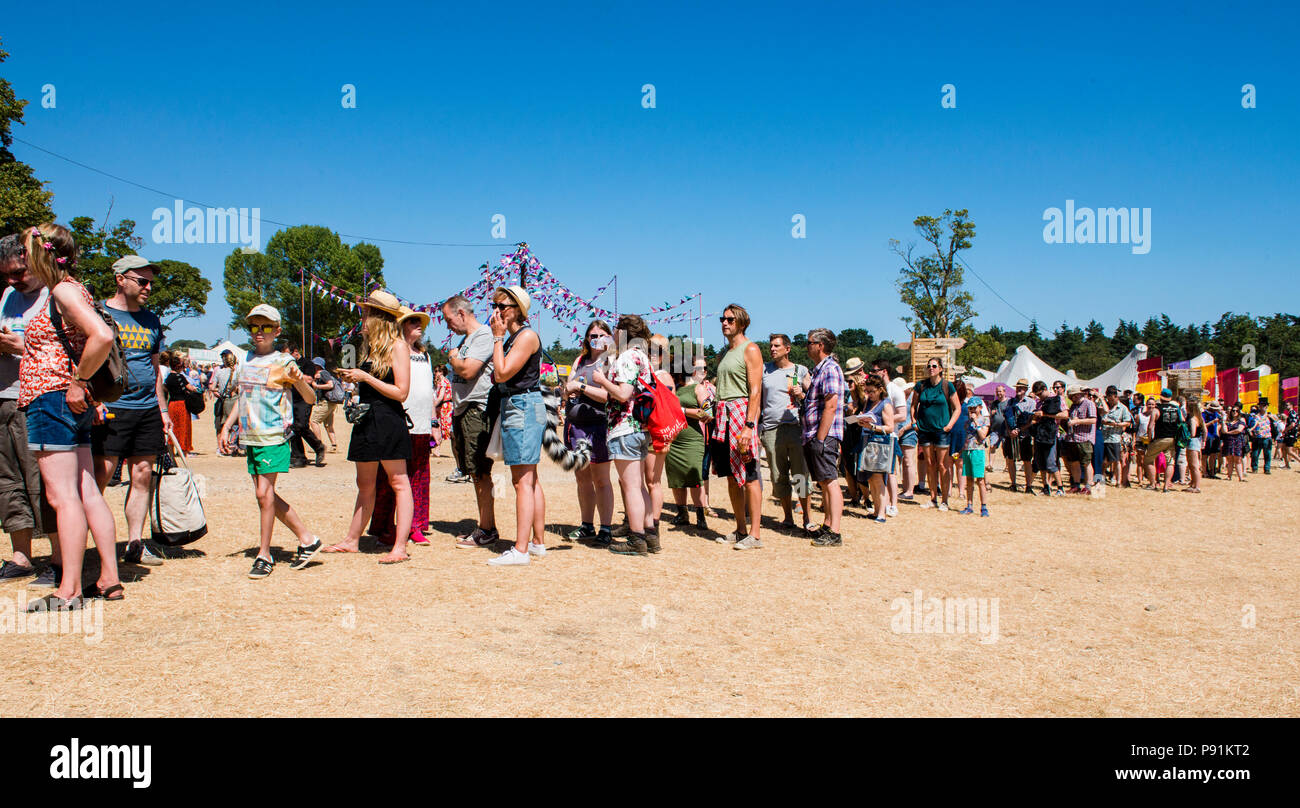 Very long queues outside the comedy stage in the sweltering heat at Latitude Festival, Henham Park, Suffolk, England, 14th July, 2018 Stock Photo