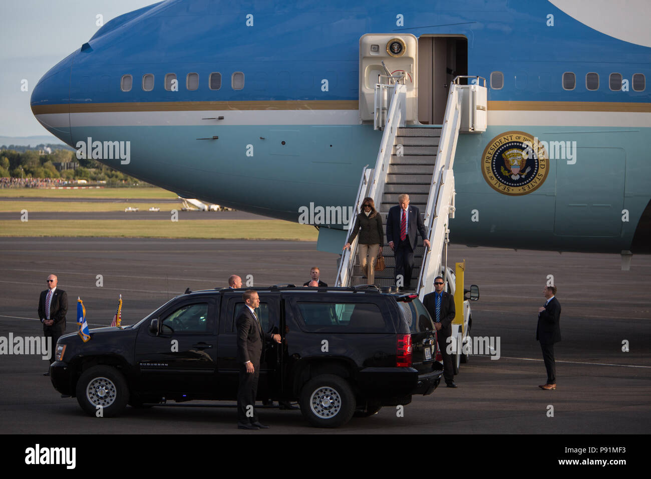 Prestwick, Scotland, on 13 July 2018. President Donald Trump, and wife Melania, arrive on Air Force One at Glasgow Prestwick International Airport at the start of a two day trip to Scotland. Image Credit: Jeremy Sutton-Hibbert/ Alamy News. Stock Photo